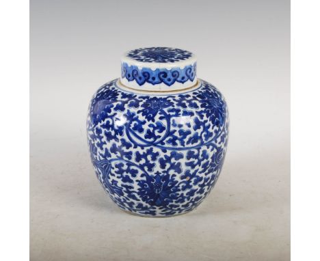 A Chinese porcelain blue and white jar and cover, Qing Dynasty, decorated with lotus scroll, double ring mark, 19.5cm high.