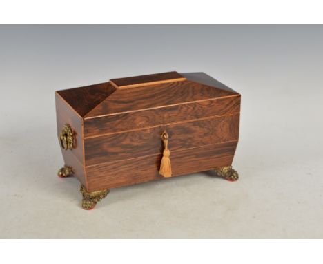 A 19th century rosewood sarcophagus shaped tea caddy, the hinged cover opening to a fitted interior of a cut glass mixing bow