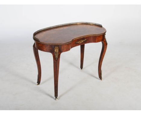 A Victorian burr walnut, marquetry and gilt metal mounted kidney shaped writing table, the shaped top with a pierced three qu