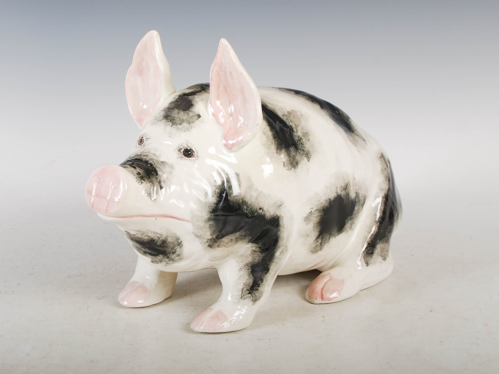 A Wemyss Ware pottery pig, with black markings and pink details ...