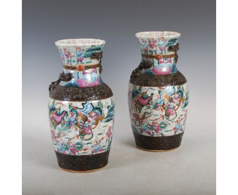 A pair of Chinese porcelain famille rose crackle glaze Warrior vases, Qing Dynasty, decorated with warriors on horseback and 