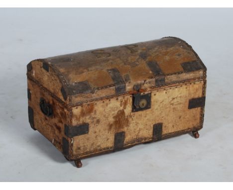 An 18th century pony skin and iron bound dome top trunk, the hinged cover with brass studded initials 'S.P.', opening to a fl