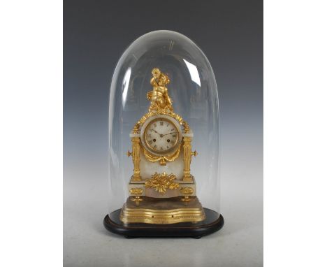 A late 19th century French alabaster and gilt metal mounted mantle clock, the circular dial with Roman numerals and twin trai