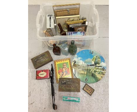 A box of assorted misc vintage items to include pictures, bottles, boxed harmonica, wooden items and tins. 