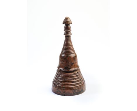 A LACQUERED WOOD MODEL STUPA, THAILAND, 18TH/19TH CENTURY with ridged bell shaped body, tiered finial at the top, 17cmSurface