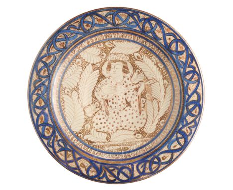 A KASHAN STYLE LUSTRE CHARGER, PROBABLY SPAIN, 20TH CENTURY of wide shallow form, painted with a figure of a seated musician,
