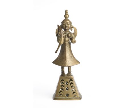 A BRONZE FIGURE OF LAKSHMI, BENGAL, EASTERN INDIA, 19TH CENTURY the goddess standing on a separately cast pierced pyramidal b