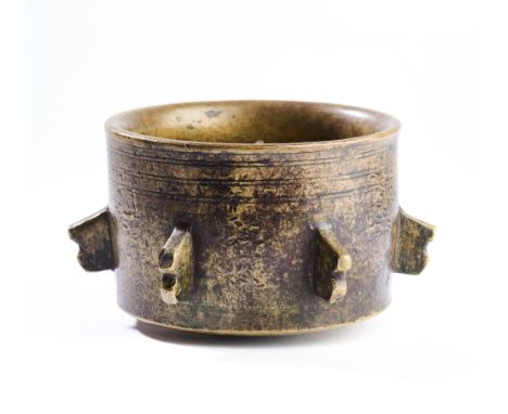 A BRONZE MORTAR, ANDALUCIA, SOUTHERN SPAIN, 13TH/14TH CENTURY of gently flared cylindrical form, with convex base, the sides 