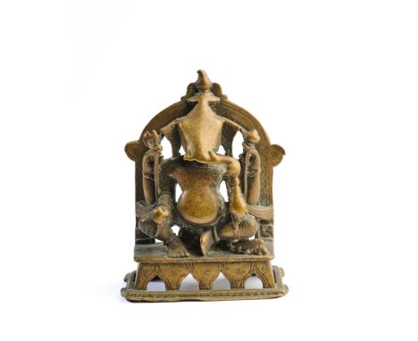 A BRONZE FIGURE OF GANESHA, WESTERN INDIA, 16TH17TH CENTURY the elephant headed deity seated on an openwork throne within an 
