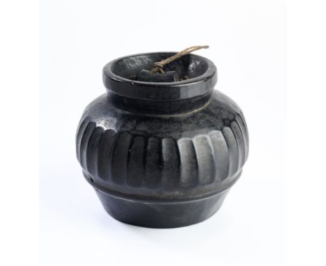 A SOUTH-EAST ASIAN CARVED WOOD BOWL, PROBABLY INDONESIA, CIRCA 19TH CENTURY with fluted sides and tapered neck, 12cm highslig