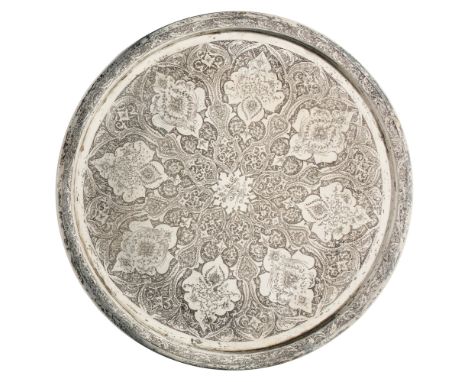 A SILVER TRAY, ISFAHAN, PERSIA, MID-20TH CENTURY of circular form, with shallow raised lip, intricately engraved and hammered
