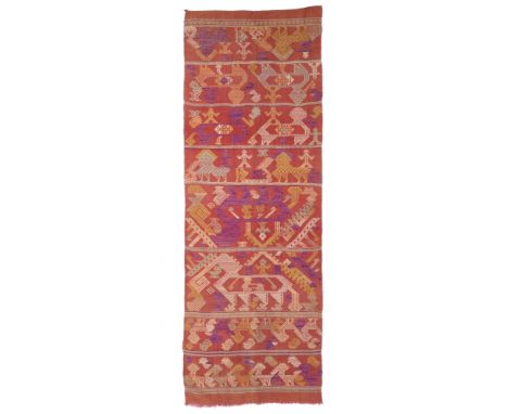 A COTTON AND SILK SASH, LAOS, EARLY 20TH CENTURY  
of rectangular form, the russet ground decorated with polychrome registers