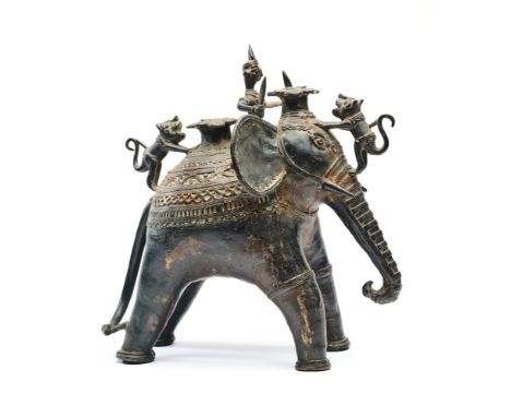 A BASTAR BRONZE FIGURE OF AN ELEPHANT, CENTRAL INDIA, 19TH/20TH CENTURY of stylised form, ridden by crowned mahout, figures o
