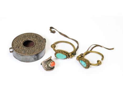 A GROUP OF TIBETAN METAL OBJECTS, 19TH CENTURY ◉ comprising a silver and copper amulet box (gau), with repousse decoration in