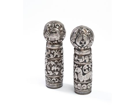 TWO SILVER SEALS, TIBET, 19TH CENTURY each of cylindrical form, with bulb-shaped finial, pierced at the neck for string attac
