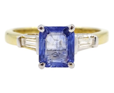 18ct gold three stone Ceylon sapphire and tapered baguette cut diamond ring, stamped 750, sapphire approx 1.85 caratCondition