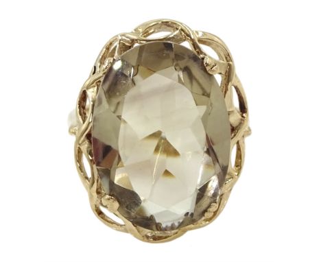 9ct gold single stone oval smokey quartz ring, hallmarkedCondition Report:Approx 5.15gm, size M, overall head = 22mm x 17mm