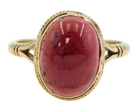 Gold single stone oval cabochon garnet ring, stamped 9ctCondition Report:Approx 3gm, stamped and tested 9ct, size P, max head