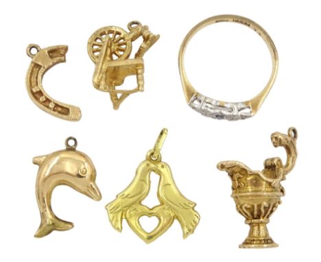 18ct gold lovebird charm, three 9ct gold charms including dolphin, spinning wheel and jug and a 9ct gold Art Deco sapphire an