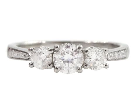 Platinum three stone round brilliant cut diamond ring, with diamond set shoulders, hallmarked, total diamond weight approx 0.