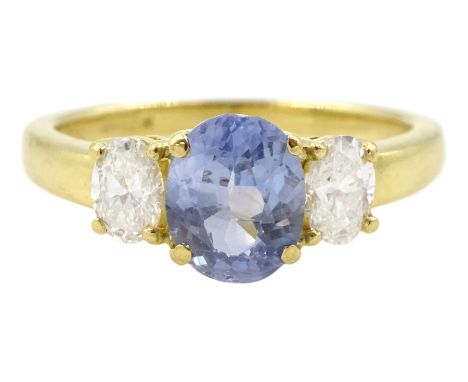 18ct gold three stone oval cut sapphire and oval cut diamond ring, stamped 750, sapphire approx 0.95 carat, total diamond wei