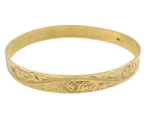 9ct gold bangle, with bright cut foliate decoration, stamped 9.375Condition Report:Approx 20.1gm inner circumference = 19.5cm
