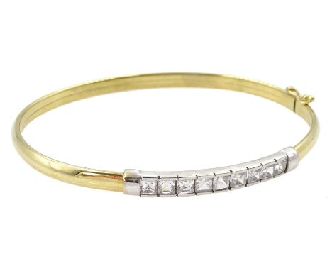 9ct white and yellow gold nine stone cubic zirconia bangle, hallmarked Condition Report:Approx 5.1gm, inner circumference = 1