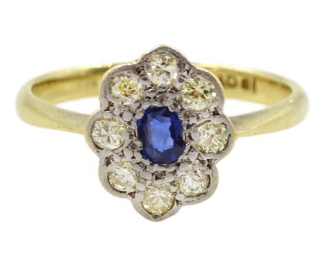 18ct gold oval sapphire and diamond cluster ring, stamped 18ct PlatCondition Report:Approx 2.5gm, size K, overall head  = 10.