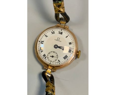 Omega - a 1920s 9ct gold cased wristwatch, white enamel dial, bold Roman numerals, subsidiary seconds, manual wind movement, 