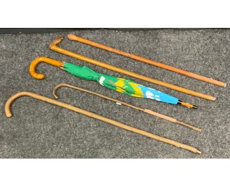 Walking sticks - a carved horse head stick;  an oriental bamboo stick carved with traditional motifs of a serpent chasing a m