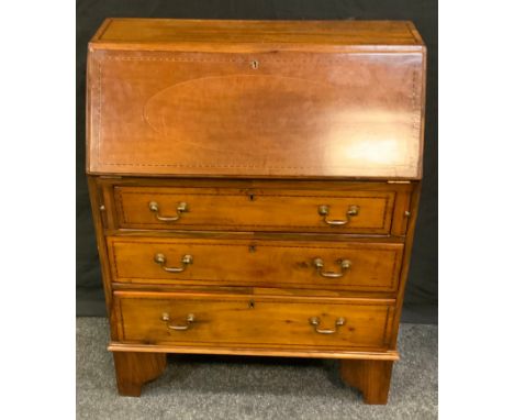An Edwardian mahogany bureau, fall front enclosing pigeonholes and a small drawer above three long graduated drawers, bracket