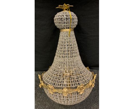 A large contemporary bag shaped ceiling light, with prismatic beads and silvered wired frame, gilt metal mounts, 111cm high 