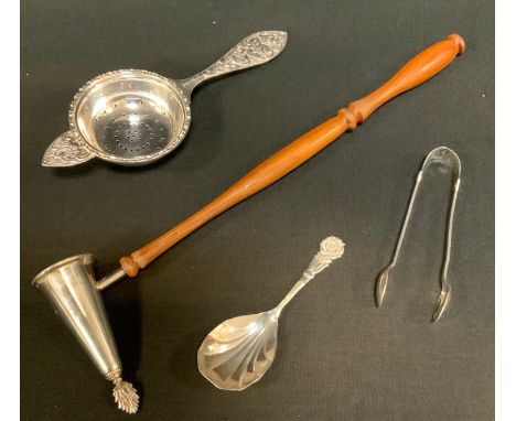 A silver straining spoon, London 1977;  caddy spoon, etc, 85.1g gross;  a silver tipped wooden candle snuffer, 46.8g gross (4