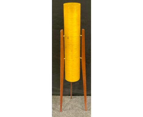 A retro floor standing Rocket lamp, amber conical shade, on three teak stands 