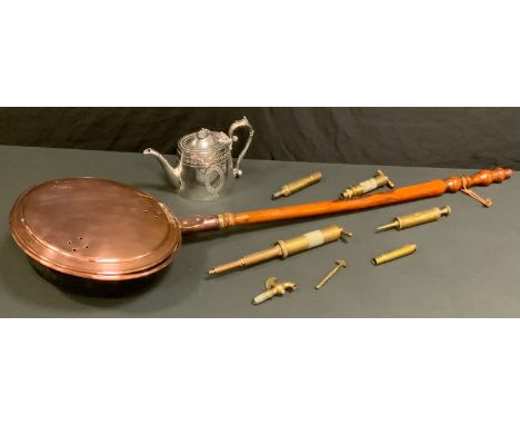 A 19th century copper warming pan, turned handle, c.1890;  an EPBM teapot;  brass taps and syringes;  etc 