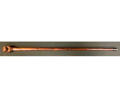 A Boer war period prisoner of war walking stick, carved as a clenched fist, inscribed 1912, Bermuda, P.O.W, 89cm long 