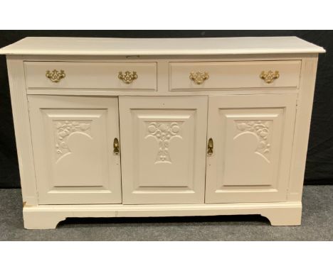 An early/mid 20th century painted pine sideboard, rectangular top above two short drawers and three cupboard doors, bracket f