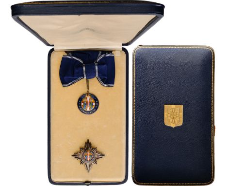 A Dame Grand Cross set: the badge, 46x42 mm, in gilt Silver, blue enamel and redenameled royal crown; applied enameled medall