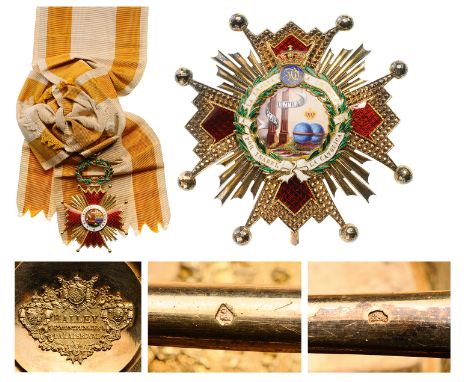 A Grand Cross set: the order’s badge in gold, 89x59 mm,  red enameled arms (minorcracks) and elaborately embossed/chiselled, 