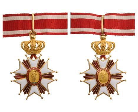 A Commander’s Cross of the Order in GOLD,89x60 mm, with white enameled arms enriched bygrooved borders and ball-finials, flan