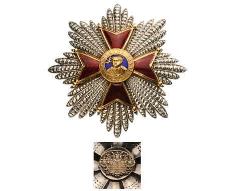 A Grand Cross breast star, 83 mm,  with chiselled and pierced rays; the centre in gold and enamels with excellent chiselwork 