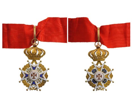 A Commander’s Cross. Neck Badge, 78x47 mm.,GOLD, ca. 28 g., white enamel bordered cross, flankedby oval escutcheons with the 