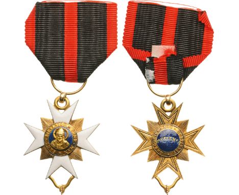 A most early Knight’s Cross in GOLD and white enamel to the obverse (the reverse, finely engraved),39x30 mm, flanked by engra