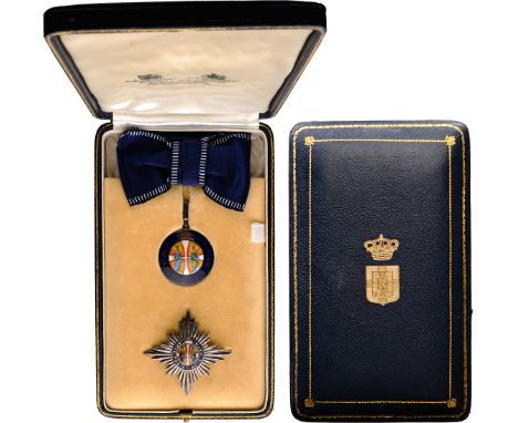 A Dame Grand Commander’s set: the badge, 46x42 mm, in Silver, blue enamel and red enameledroyal crown; applied enameled medal