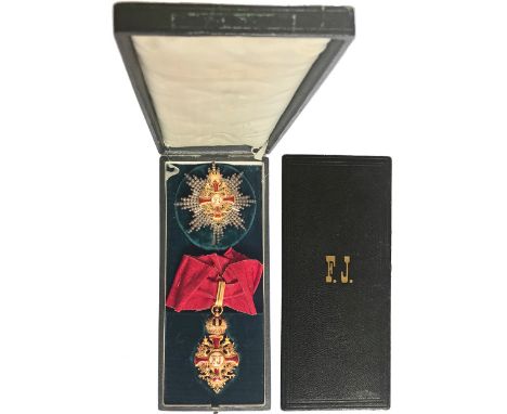 A group of Commander with Star: neck cross in GOLD with red enameled arms, 69x37 mm, flanked by the black enameled imperial e