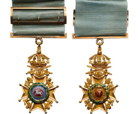 A Knight’s Cross with Swords of a somewhat reduced size, 49x27 mm,  in chiselled GOLD with most finely enameled centres; susp