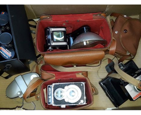 Box with five vintage cameras and a pair of binoculars 