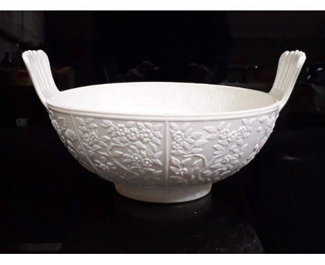 A late 19th Century Sowerby blac-de-lait pressed glass bowl with comb handles and Aesthetic decoration, length 23cm. 