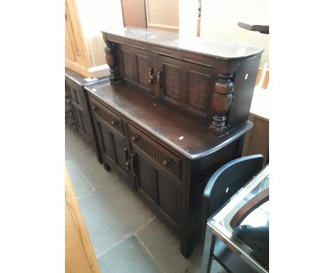 An Ercol Priory style buffet sideboard. 