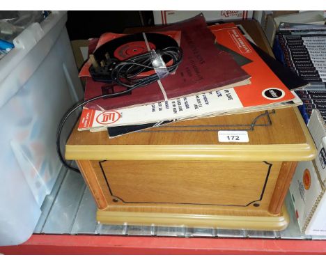 A retro style record player and some records 